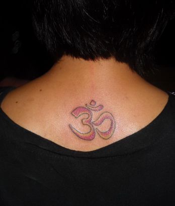 Om Tattoo On Back Of Girl